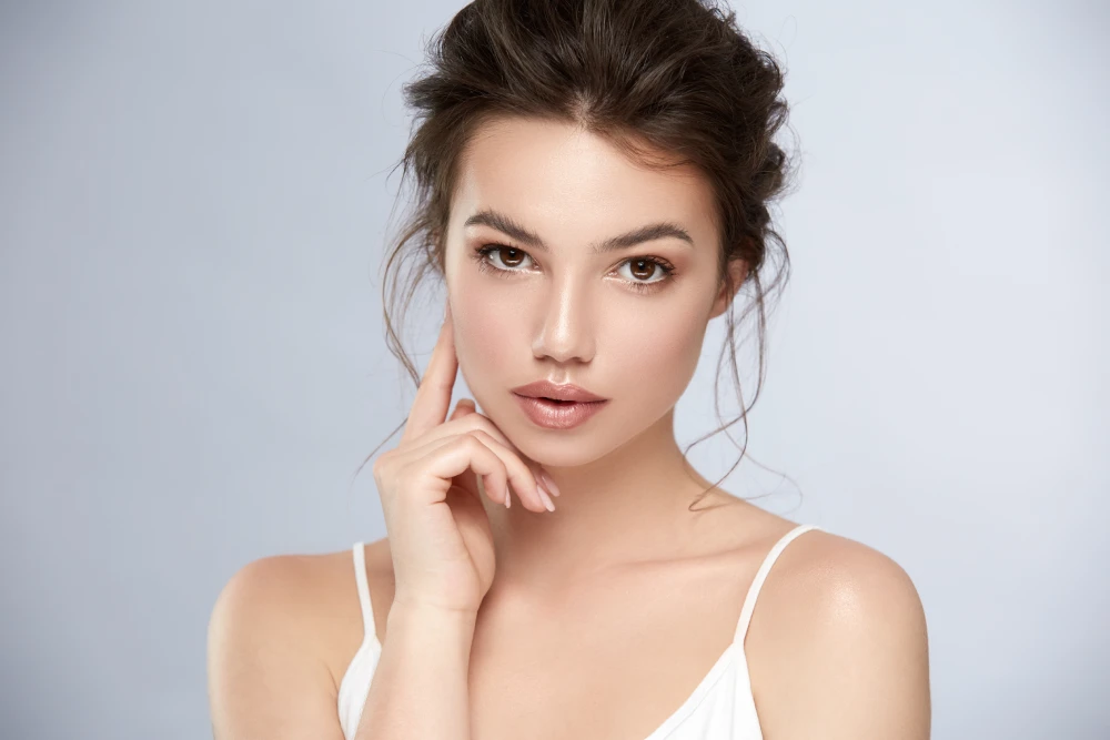 Woman with radiant skin after a SaltFacial treatment.