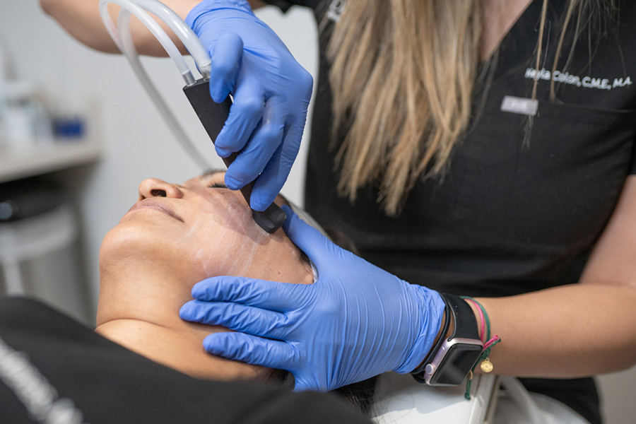Aesthetician performing a facial treatment